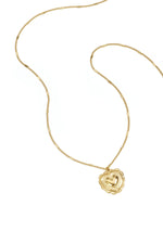 Necklace with flat details and large pendant